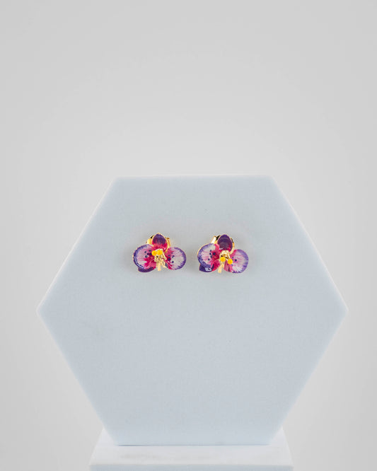 Handcrafted in Tuscany, the Marri Cortona Orchidea Earrings in 18k gold bronze are hand-enameled jewels that blend light, artistry, and timeless elegance.