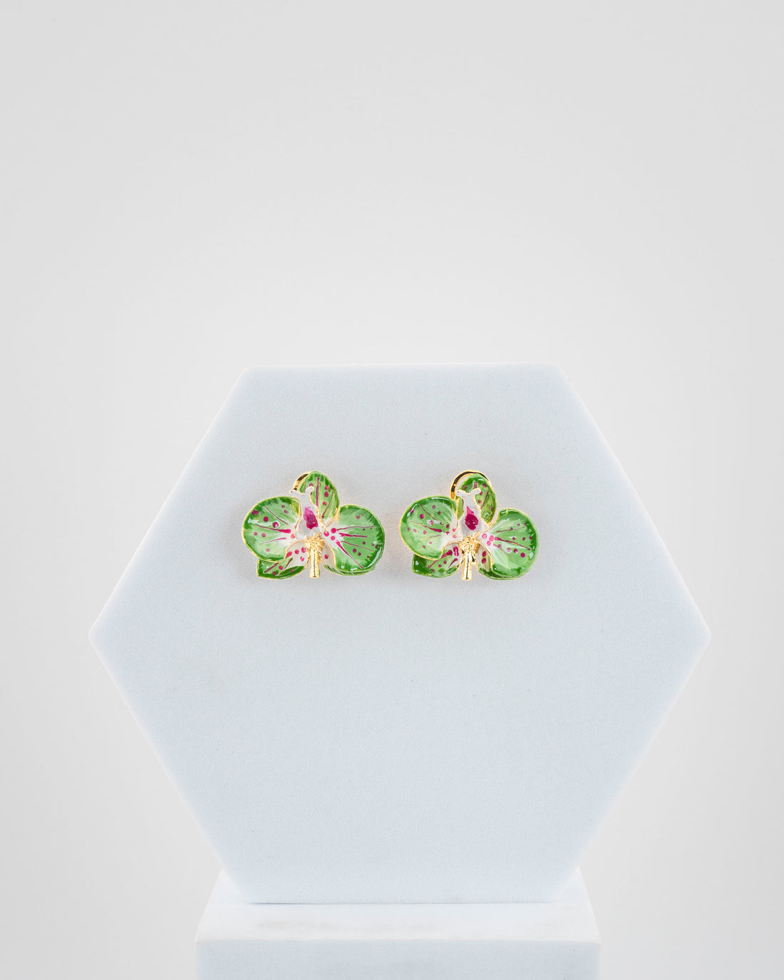 Handcrafted in Tuscany, the Marri Cortona Orchidea Earrings in 18k gold bronze are hand-enameled jewels that blend light, artistry, and timeless elegance.