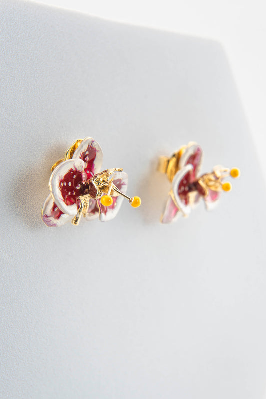 Handcrafted in Tuscany, the Marri Cortona Orchidea Earrings in 18k gold bronze are hand-enameled jewels that blend light, artistry, and timeless elegance.