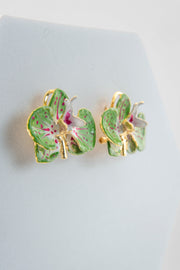 Handcrafted in Tuscany, the Marri Cortona Orchidea Earrings in 18k gold bronze are hand-enameled jewels that blend light, artistry, and timeless elegance.