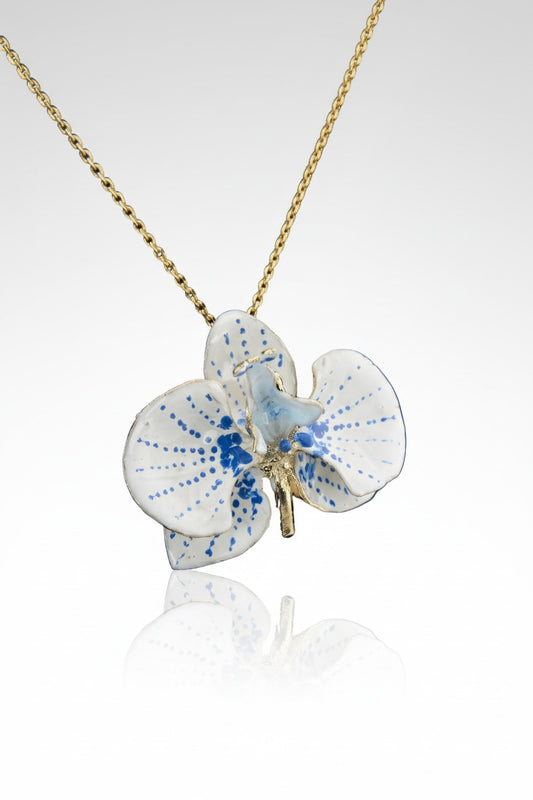 Handcrafted in Tuscany, the Marri Cortona Orchidea Necklace in 18k gold bronze captures the orchid’s grace — elegant, hand-enameled, and timelessly Italian.