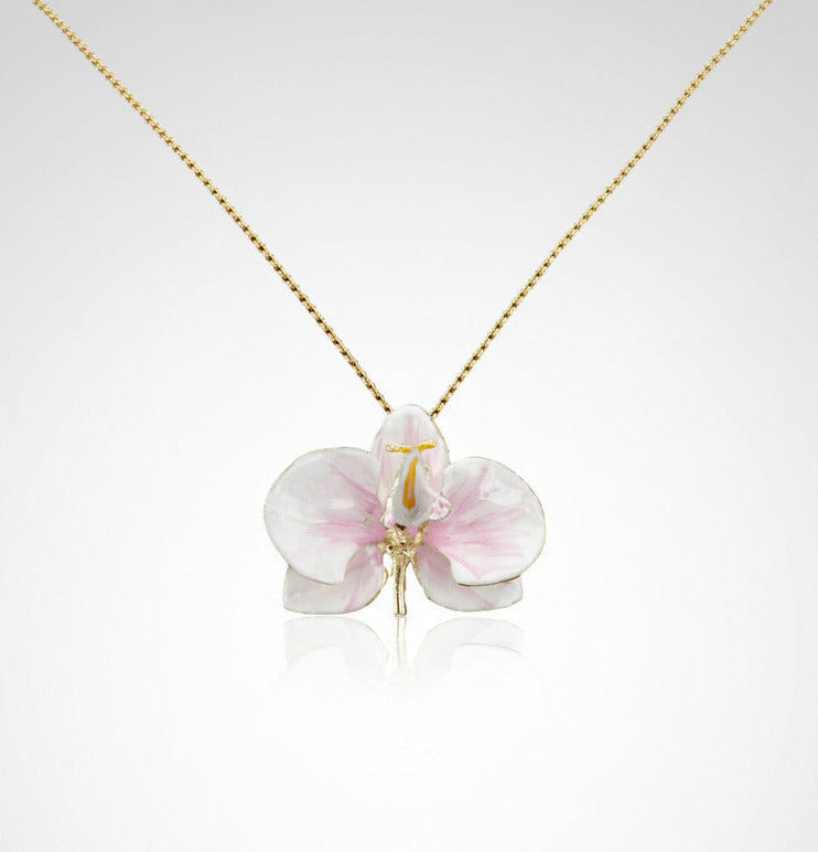 Handcrafted in Tuscany, the Marri Cortona Orchidea Necklace in 18k gold bronze captures the orchid’s grace — elegant, hand-enameled, and timelessly Italian.