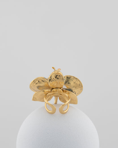Handcrafted in Tuscany, the Marri Cortona Orchidea Ring in 18k gold bronze captures the orchid’s grace — unique, hand-enameled, and timelessly elegant.