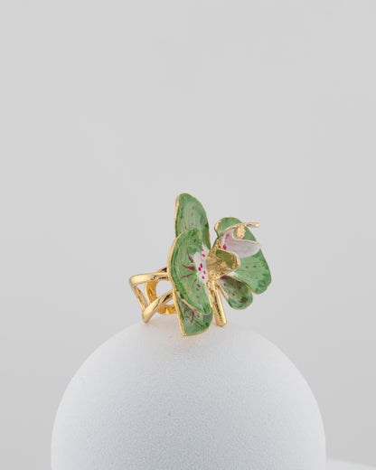 Handcrafted in Tuscany, the Marri Cortona Orchidea Ring in 18k gold bronze captures the orchid’s grace — unique, hand-enameled, and timelessly elegant.