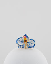 Handcrafted in Tuscany, the Marri Cortona Orchidea Ring in 18k gold bronze captures the orchid’s grace — unique, hand-enameled, and timelessly elegant.