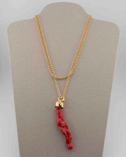 A handcrafted necklace in 18K gold-plated bronze featuring a coral-inspired pendant.
Designed by Marri Cortona and handmade in Tuscany with timeless elegance.