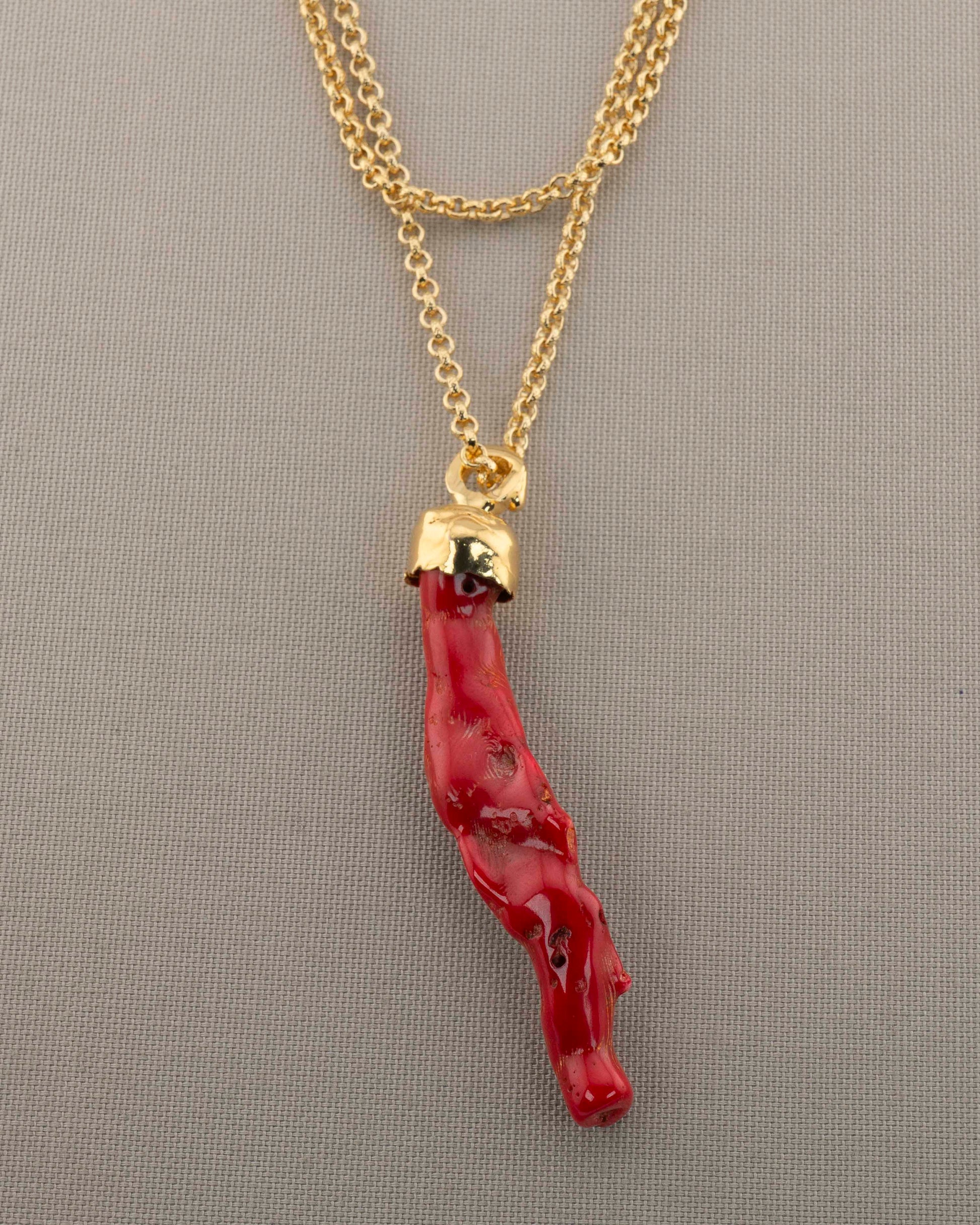 A handcrafted necklace in 18K gold-plated bronze featuring a coral-inspired pendant.
Designed by Marri Cortona and handmade in Tuscany with timeless elegance.