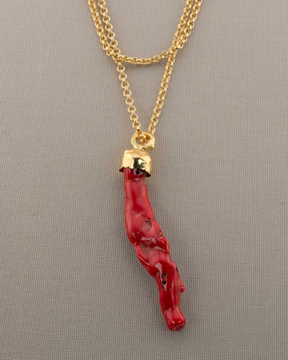 A handcrafted necklace in 18K gold-plated bronze featuring a coral-inspired pendant.
Designed by Marri Cortona and handmade in Tuscany with timeless elegance.