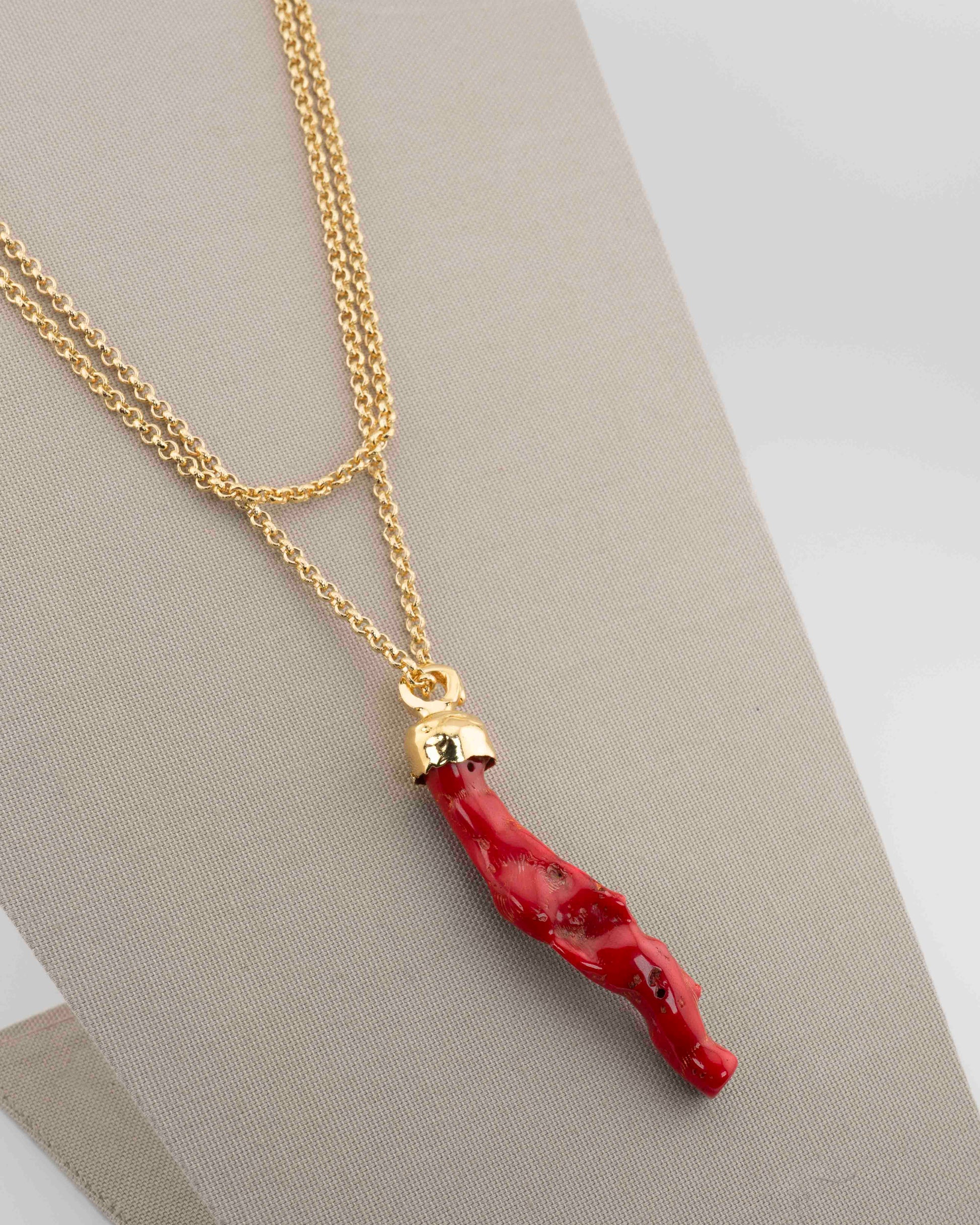 A handcrafted necklace in 18K gold-plated bronze featuring a coral-inspired pendant.
Designed by Marri Cortona and handmade in Tuscany with timeless elegance.
