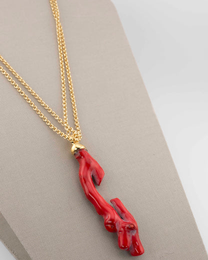 A handcrafted necklace in 18K gold-plated bronze featuring a coral-inspired pendant.
Designed by Marri Cortona and handmade in Tuscany with timeless elegance.