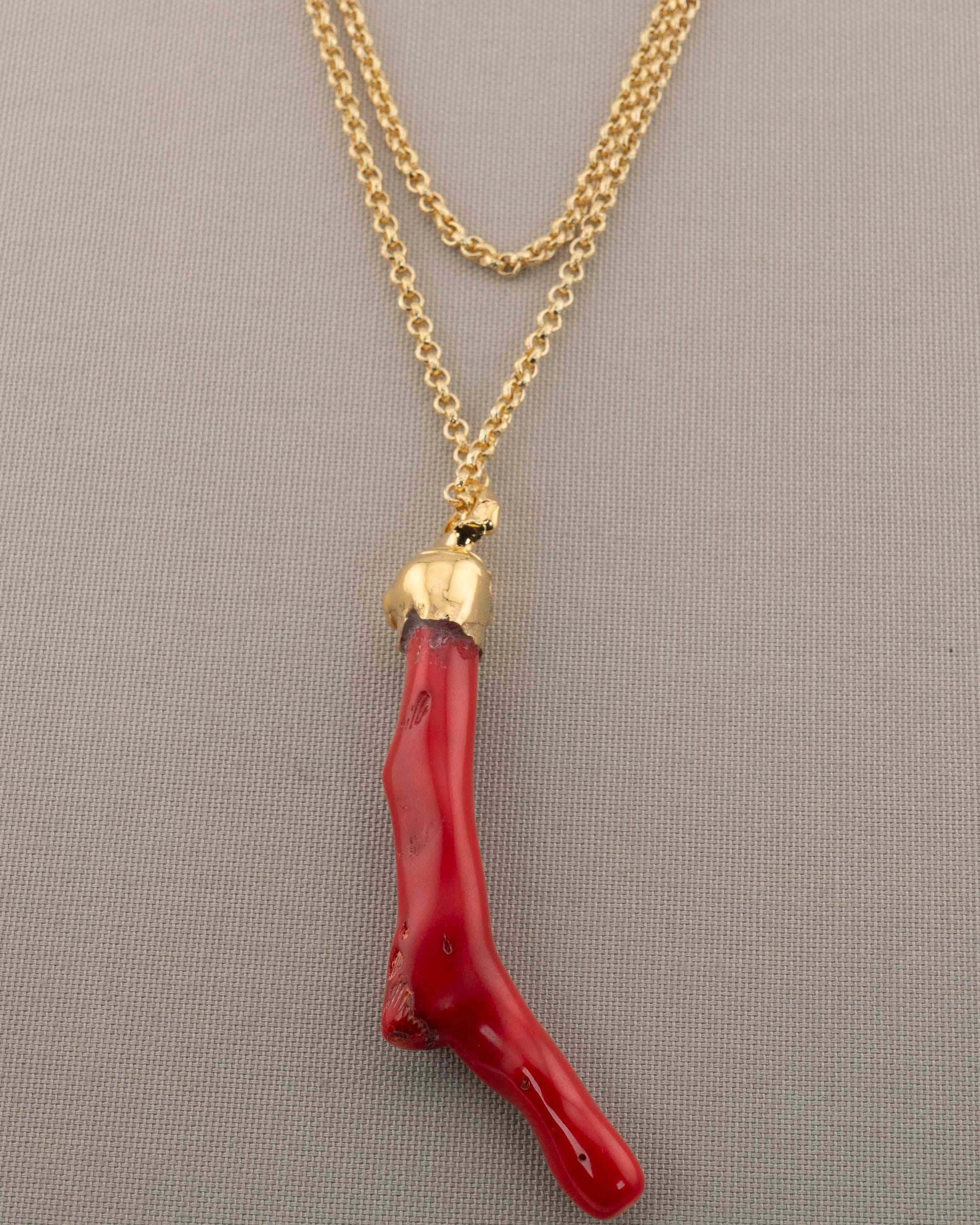 A handcrafted necklace in 18K gold-plated bronze featuring a coral-inspired pendant.
Designed by Marri Cortona and handmade in Tuscany with timeless elegance.