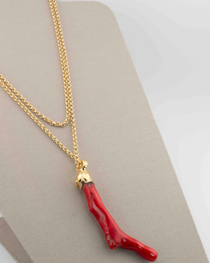 A handcrafted necklace in 18K gold-plated bronze featuring a coral-inspired pendant.
Designed by Marri Cortona and handmade in Tuscany with timeless elegance.