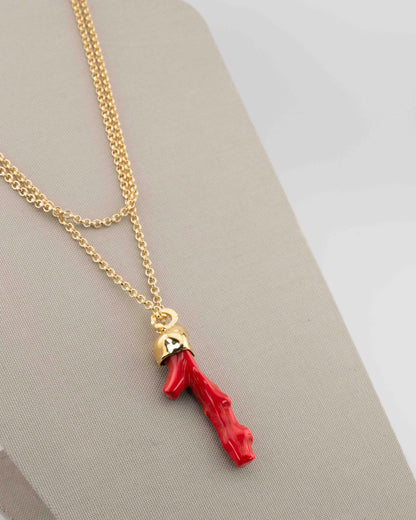 A handcrafted necklace in 18K gold-plated bronze featuring a coral-inspired pendant.
Designed by Marri Cortona and handmade in Tuscany with timeless elegance.