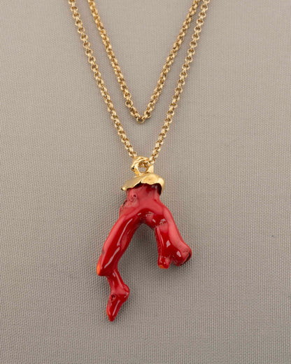 A handcrafted necklace in 18K gold-plated bronze featuring a coral-inspired pendant.
Designed by Marri Cortona and handmade in Tuscany with timeless elegance.