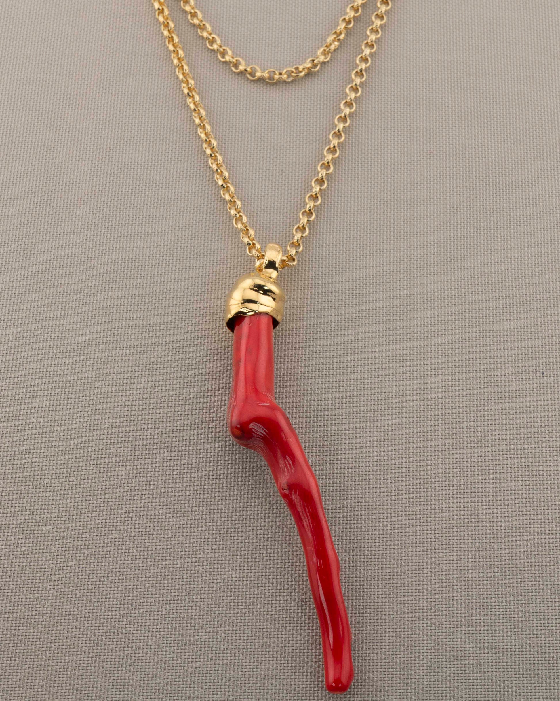 A handcrafted necklace in 18K gold-plated bronze featuring a coral-inspired pendant.
Designed by Marri Cortona and handmade in Tuscany with timeless elegance.