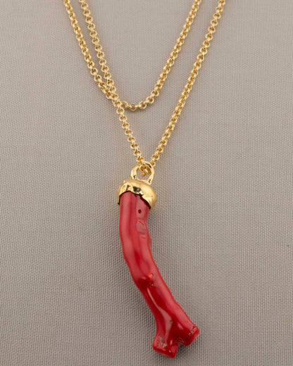 A handcrafted necklace in 18K gold-plated bronze featuring a coral-inspired pendant.
Designed by Marri Cortona and handmade in Tuscany with timeless elegance.