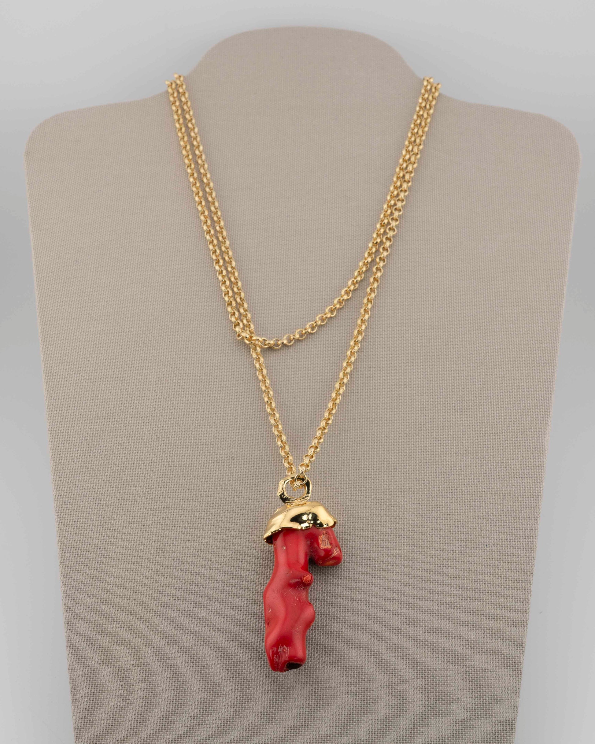 A handcrafted necklace in 18K gold-plated bronze featuring a coral-inspired pendant.
Designed by Marri Cortona and handmade in Tuscany with timeless elegance.