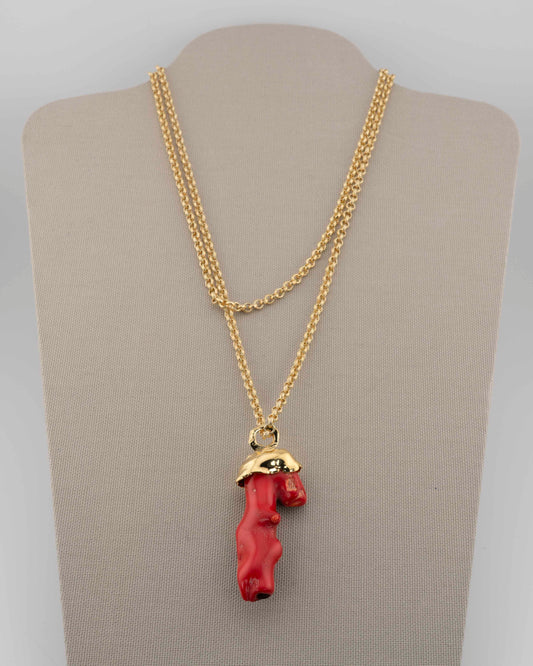 A handcrafted necklace in 18K gold-plated bronze featuring a coral-inspired pendant.
Designed by Marri Cortona and handmade in Tuscany with timeless elegance.