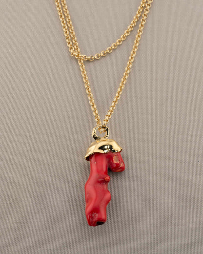 A handcrafted necklace in 18K gold-plated bronze featuring a coral-inspired pendant.
Designed by Marri Cortona and handmade in Tuscany with timeless elegance.