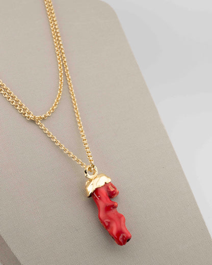 A handcrafted necklace in 18K gold-plated bronze featuring a coral-inspired pendant.
Designed by Marri Cortona and handmade in Tuscany with timeless elegance.