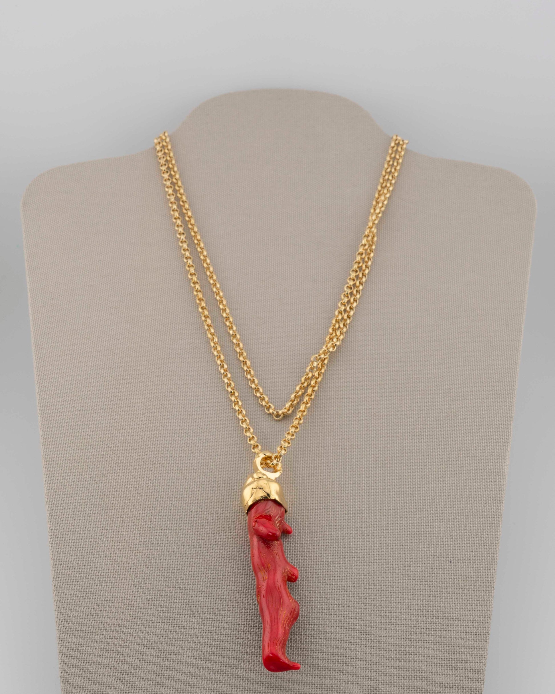 A handcrafted necklace in 18K gold-plated bronze featuring a coral-inspired pendant.
Designed by Marri Cortona and handmade in Tuscany with timeless elegance.