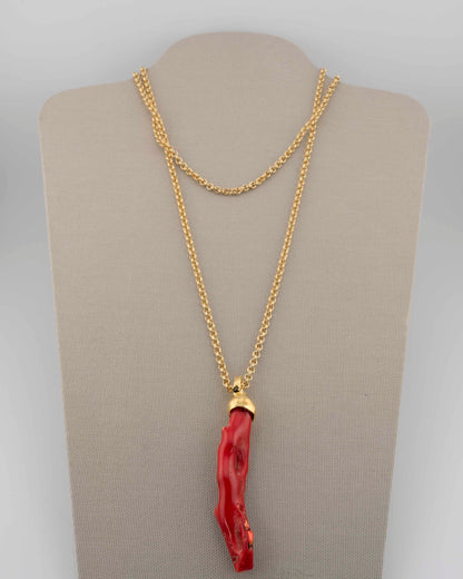 A handcrafted necklace in 18K gold-plated bronze featuring a coral-inspired pendant.
Designed by Marri Cortona and handmade in Tuscany with timeless elegance.