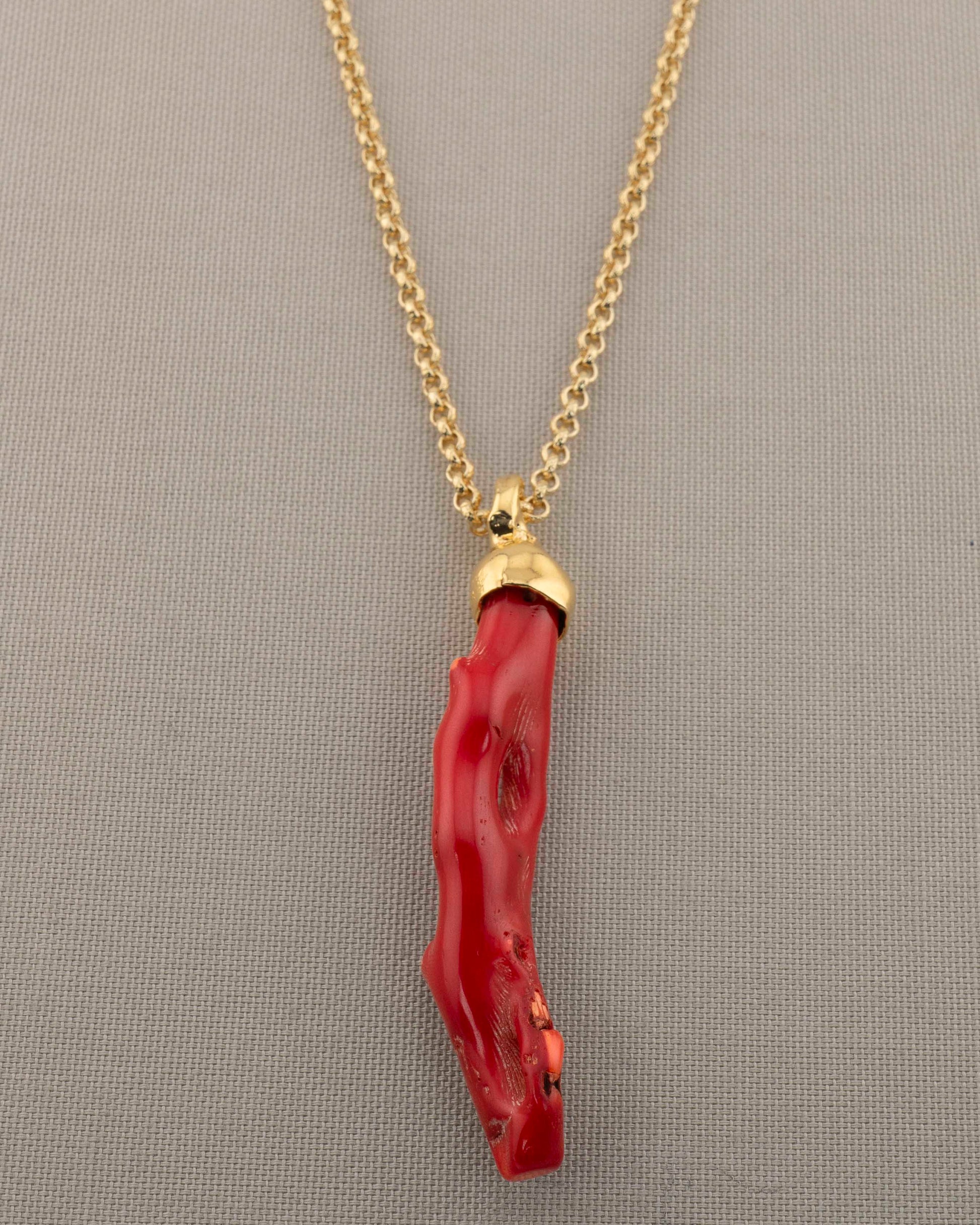 A handcrafted necklace in 18K gold-plated bronze featuring a coral-inspired pendant.
Designed by Marri Cortona and handmade in Tuscany with timeless elegance.