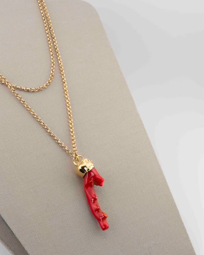 A handcrafted necklace in 18K gold-plated bronze featuring a coral-inspired pendant.
Designed by Marri Cortona and handmade in Tuscany with timeless elegance.