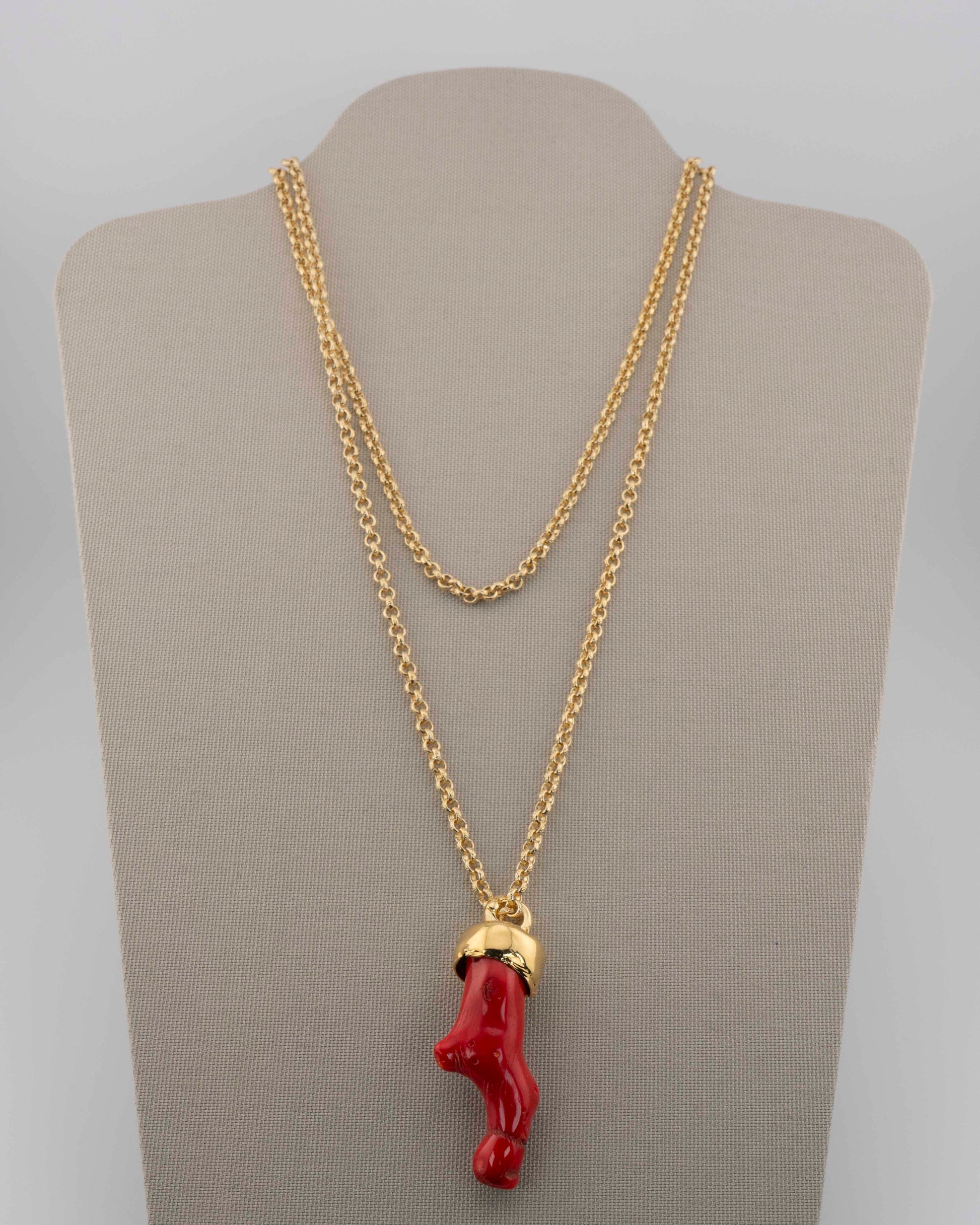 A handcrafted necklace in 18K gold-plated bronze featuring a coral-inspired pendant.
Designed by Marri Cortona and handmade in Tuscany with timeless elegance.