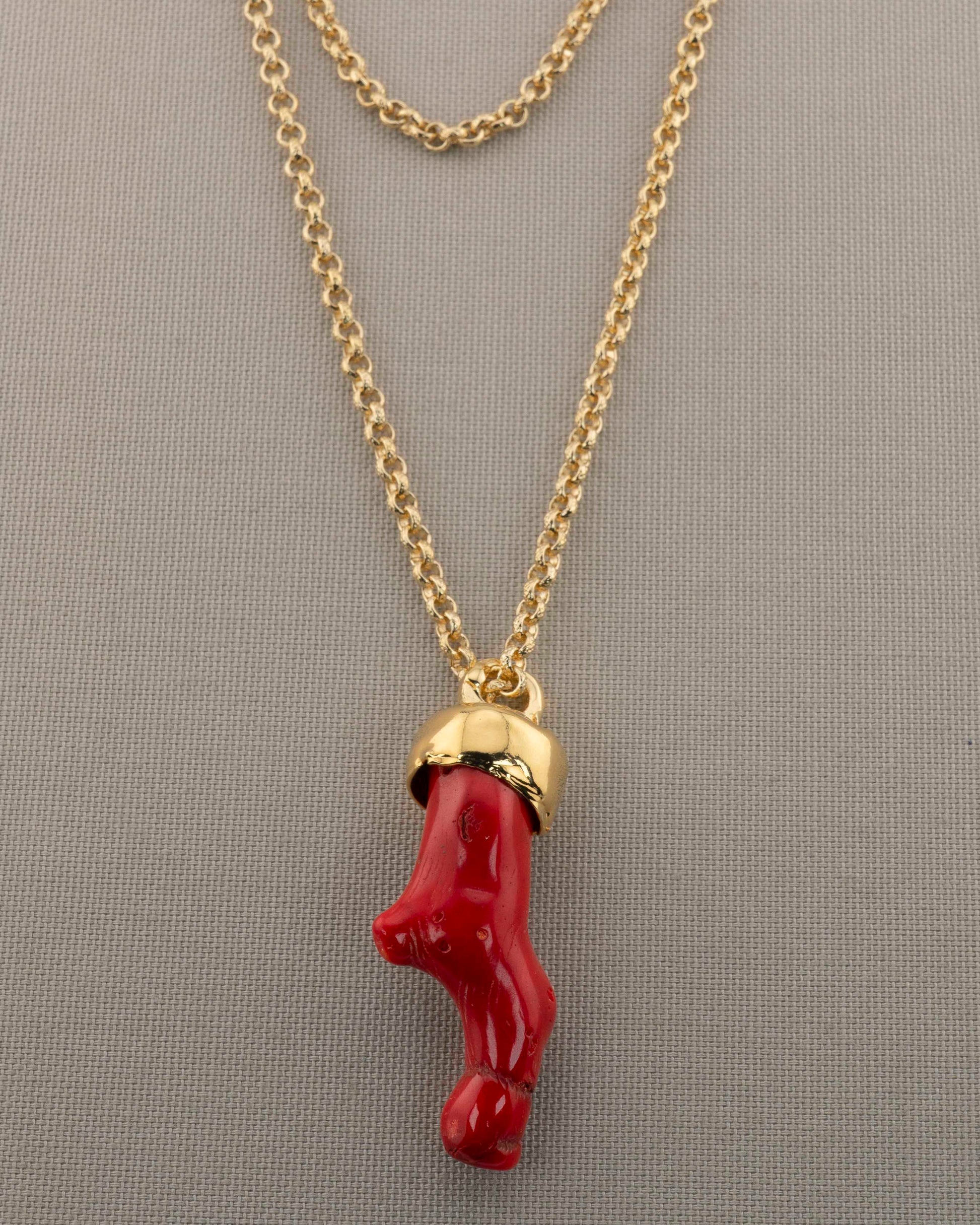 A handcrafted necklace in 18K gold-plated bronze featuring a coral-inspired pendant.
Designed by Marri Cortona and handmade in Tuscany with timeless elegance.