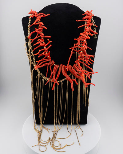 A handcrafted Mediterranean-inspired necklace in 18K gold-plated bronze with coral details. — made by hand in Tuscany.