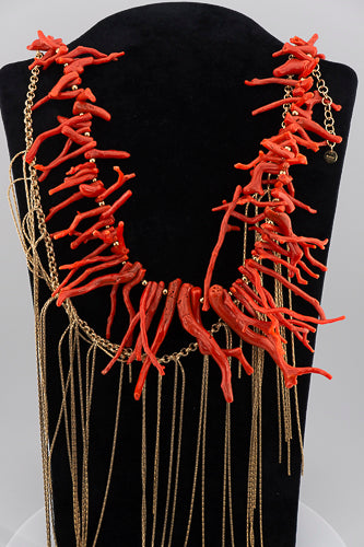 A handcrafted Mediterranean-inspired necklace in 18K gold-plated bronze with coral details. — made by hand in Tuscany.