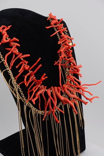 A handcrafted Mediterranean-inspired necklace in 18K gold-plated bronze with coral details. — made by hand in Tuscany.