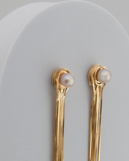 Orecchini fili di luce con perla