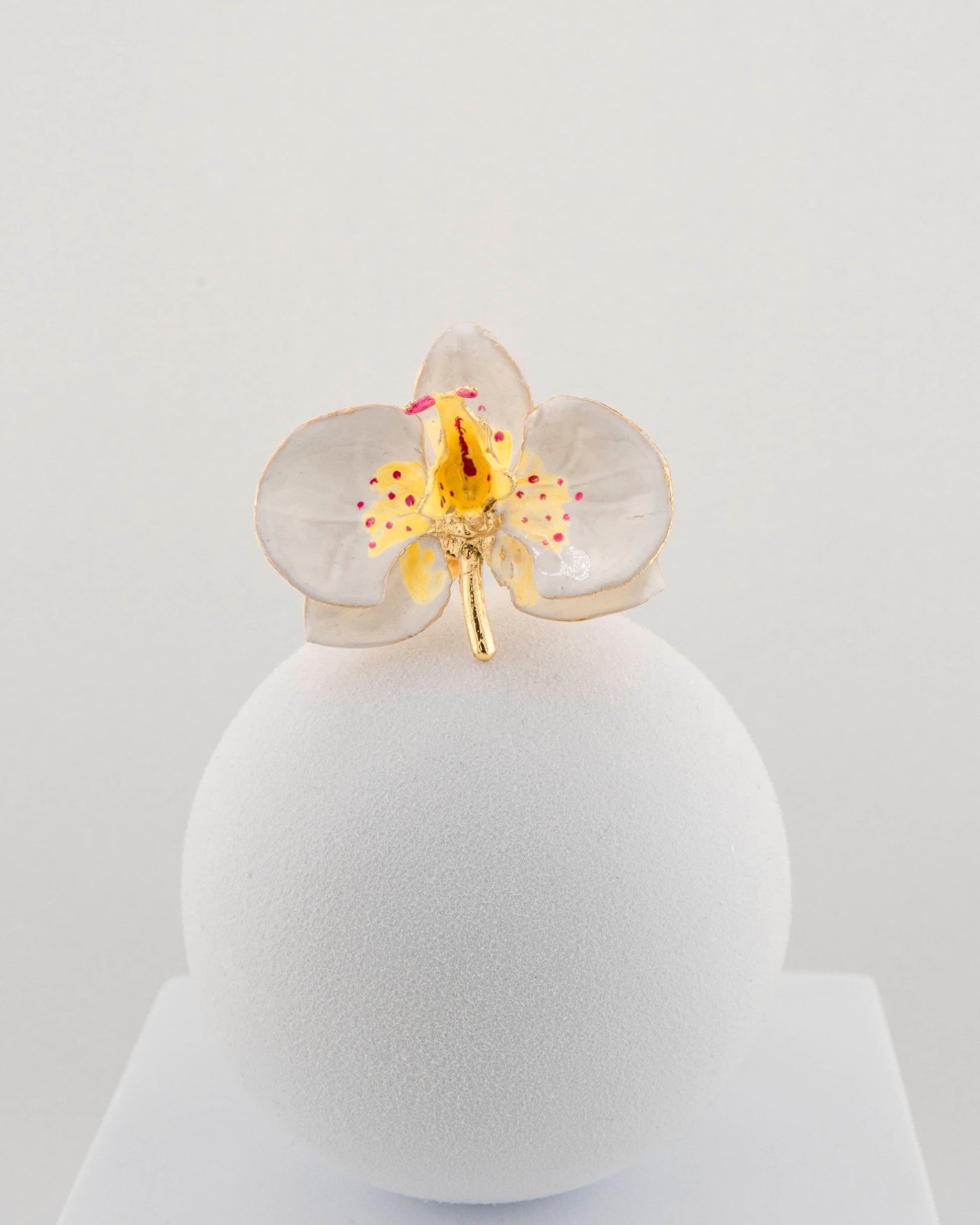 Handcrafted in Tuscany, the Marri Cortona Orchidea Ring in 18k gold bronze captures the orchid’s grace — unique, hand-enameled, and timelessly elegant.