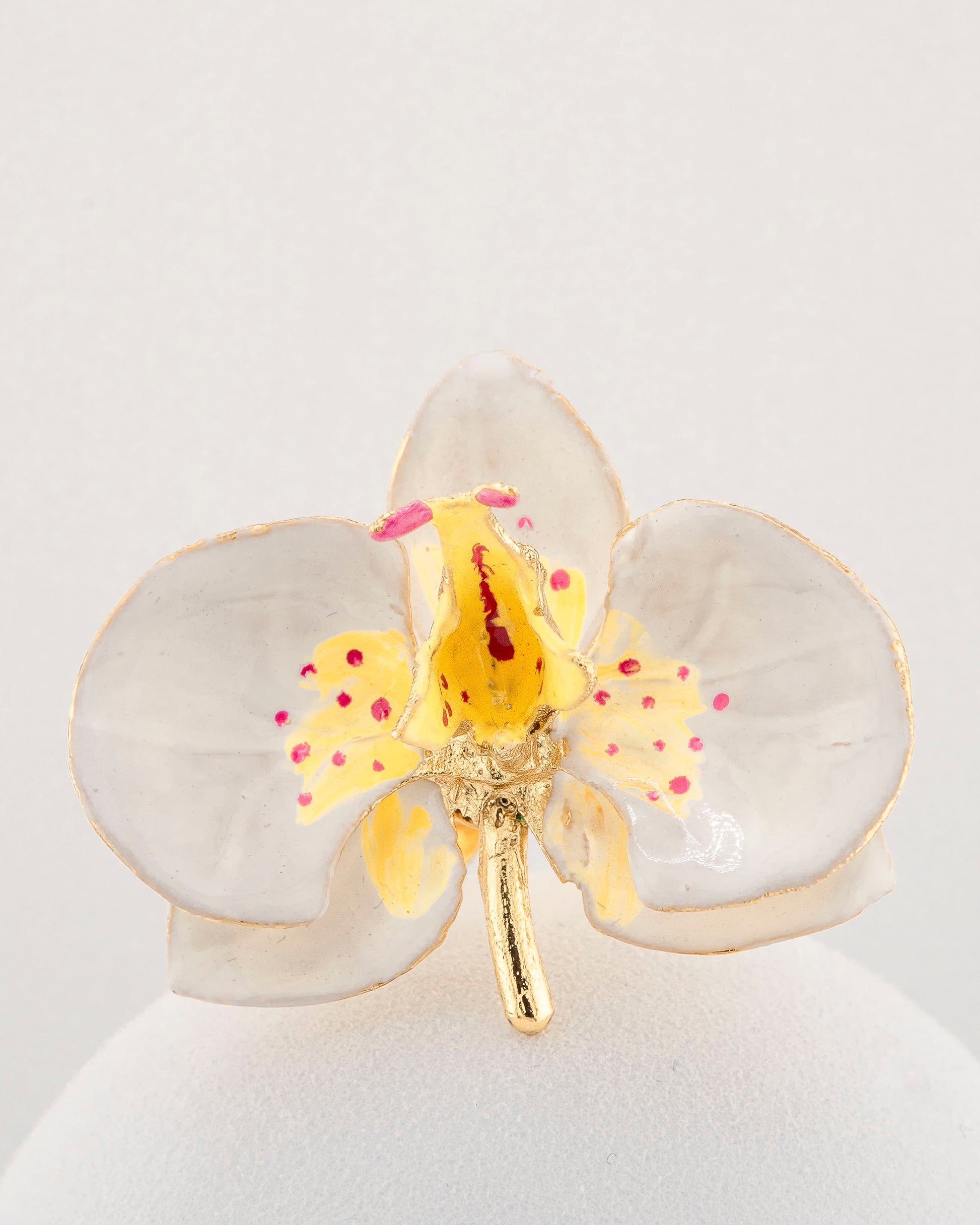 Handcrafted in Tuscany, the Marri Cortona Orchidea Ring in 18k gold bronze captures the orchid’s grace — unique, hand-enameled, and timelessly elegant.