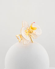 Handcrafted in Tuscany, the Marri Cortona Orchidea Ring in 18k gold bronze captures the orchid’s grace — unique, hand-enameled, and timelessly elegant.