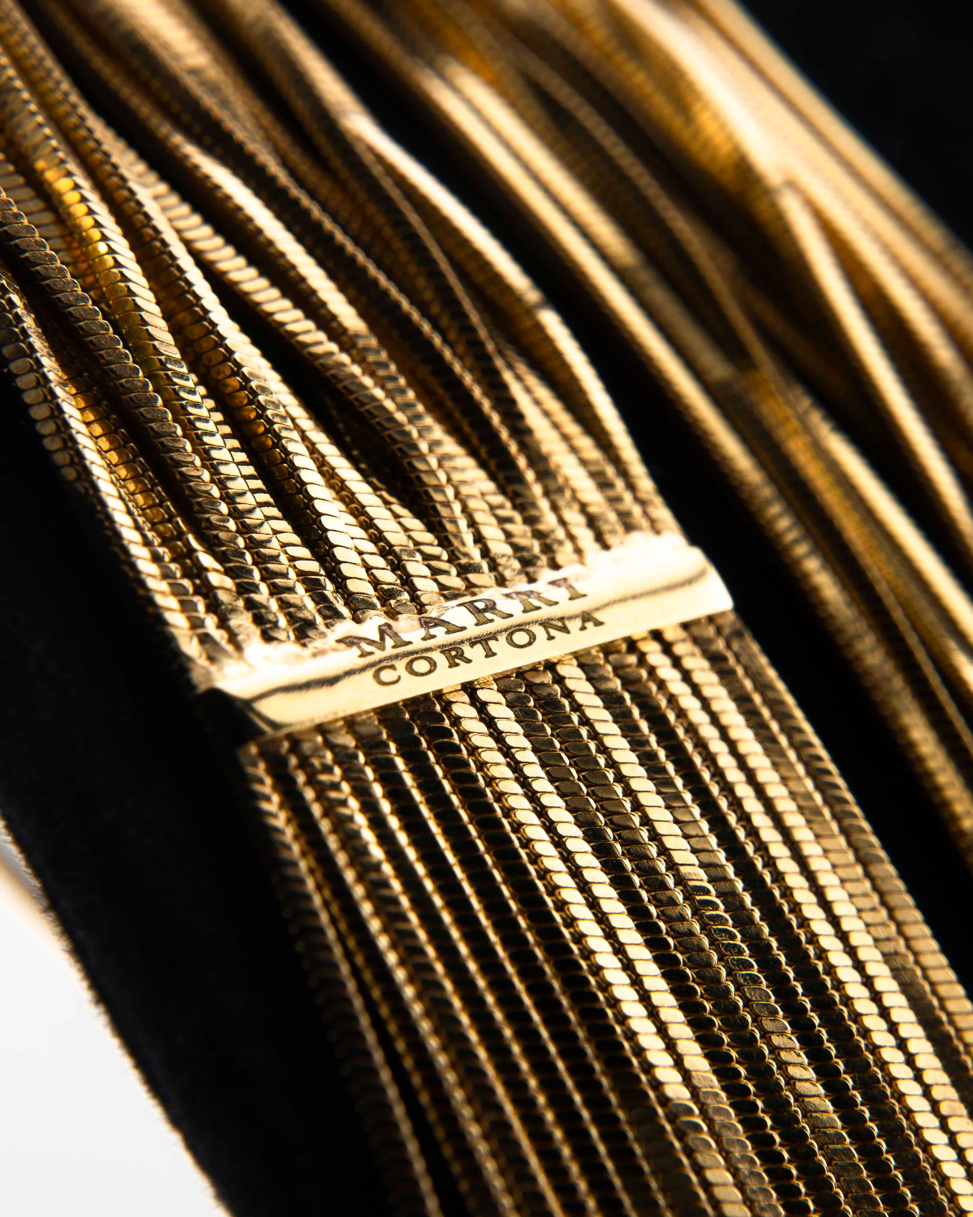 Handcrafted in Tuscany, the MarriCortona Voilà Necklace in 18k gold bronze features 23 luminous strands — a versatile icon of modern Italian elegance.