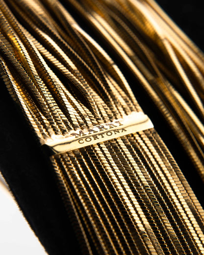 Handcrafted in Tuscany, the MarriCortona Voilà Necklace in 18k gold bronze features 23 luminous strands — a versatile icon of modern Italian elegance.