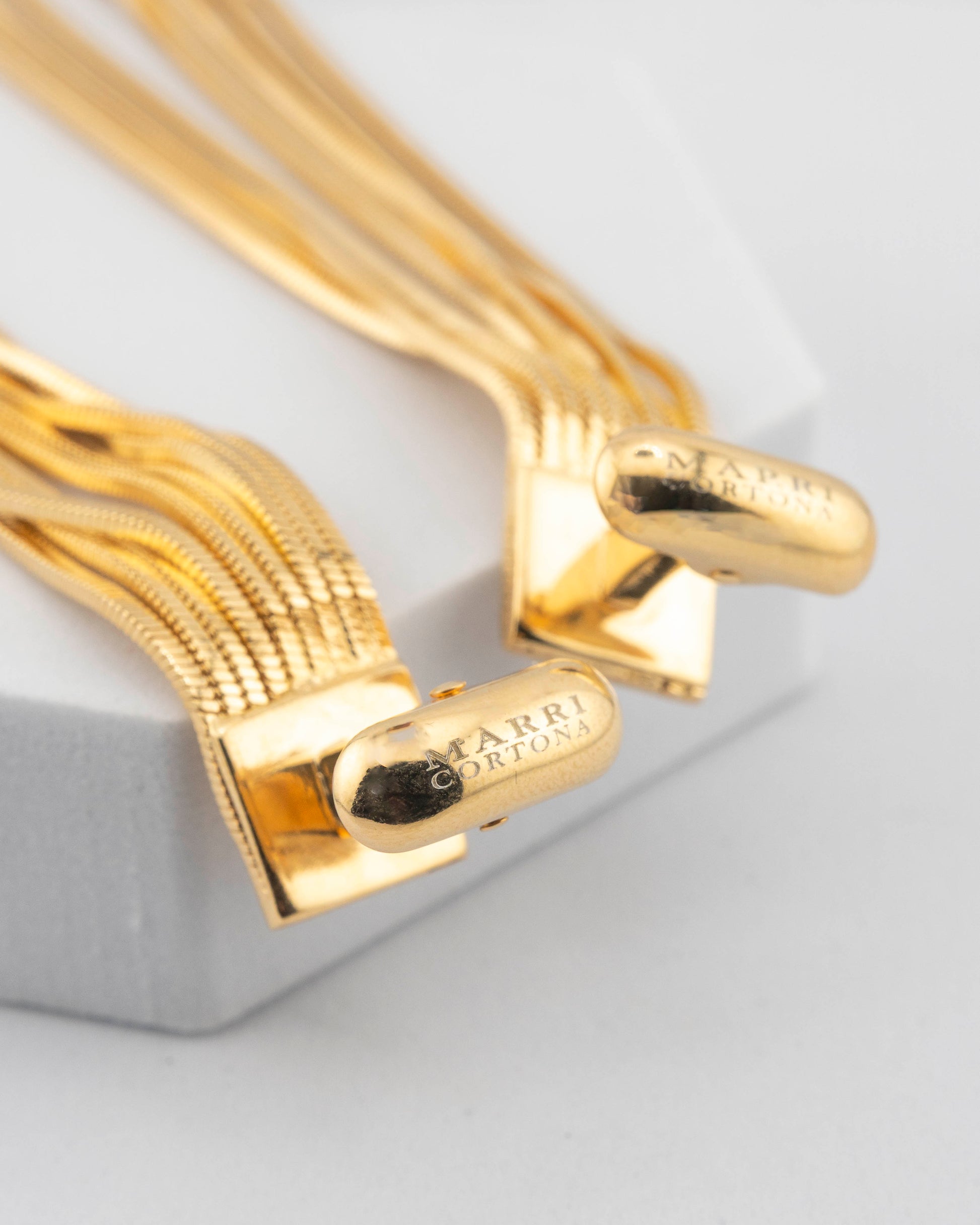 Handcrafted in Tuscany, the MarriCortona Voilà Cufflinks in 18k gold bronze blend Italian artistry and bold design — elegance redefined with modern flair.