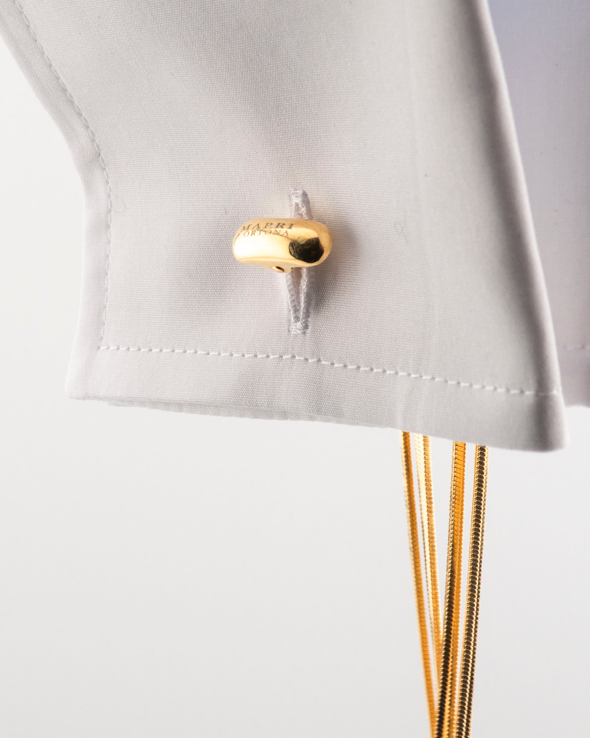 Handcrafted in Tuscany, the MarriCortona Voilà Cufflinks in 18k gold bronze blend Italian artistry and bold design — elegance redefined with modern flair.