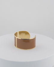 Handcrafted in Tuscany, the MarriCortona Smalto Bracelets in 18k gold and hand-painted enamel feature bold 30 mm bands — radiant, elegant, and uniquely Italian.