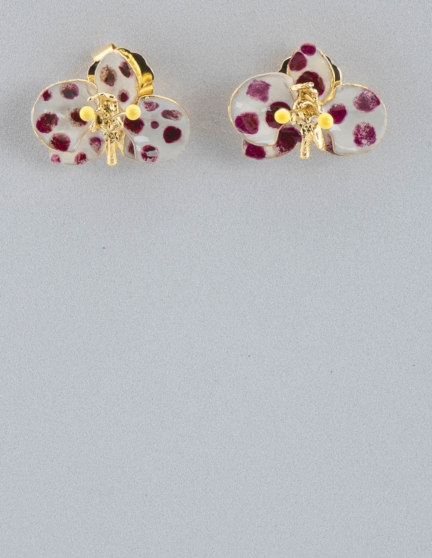 Handcrafted in Tuscany, the Marri Cortona Orchidea Earrings in 18k gold bronze are hand-enameled jewels that blend light, artistry, and timeless elegance.