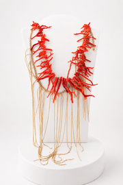 Collana  Medusa  con elementi di corallo e fili di luce