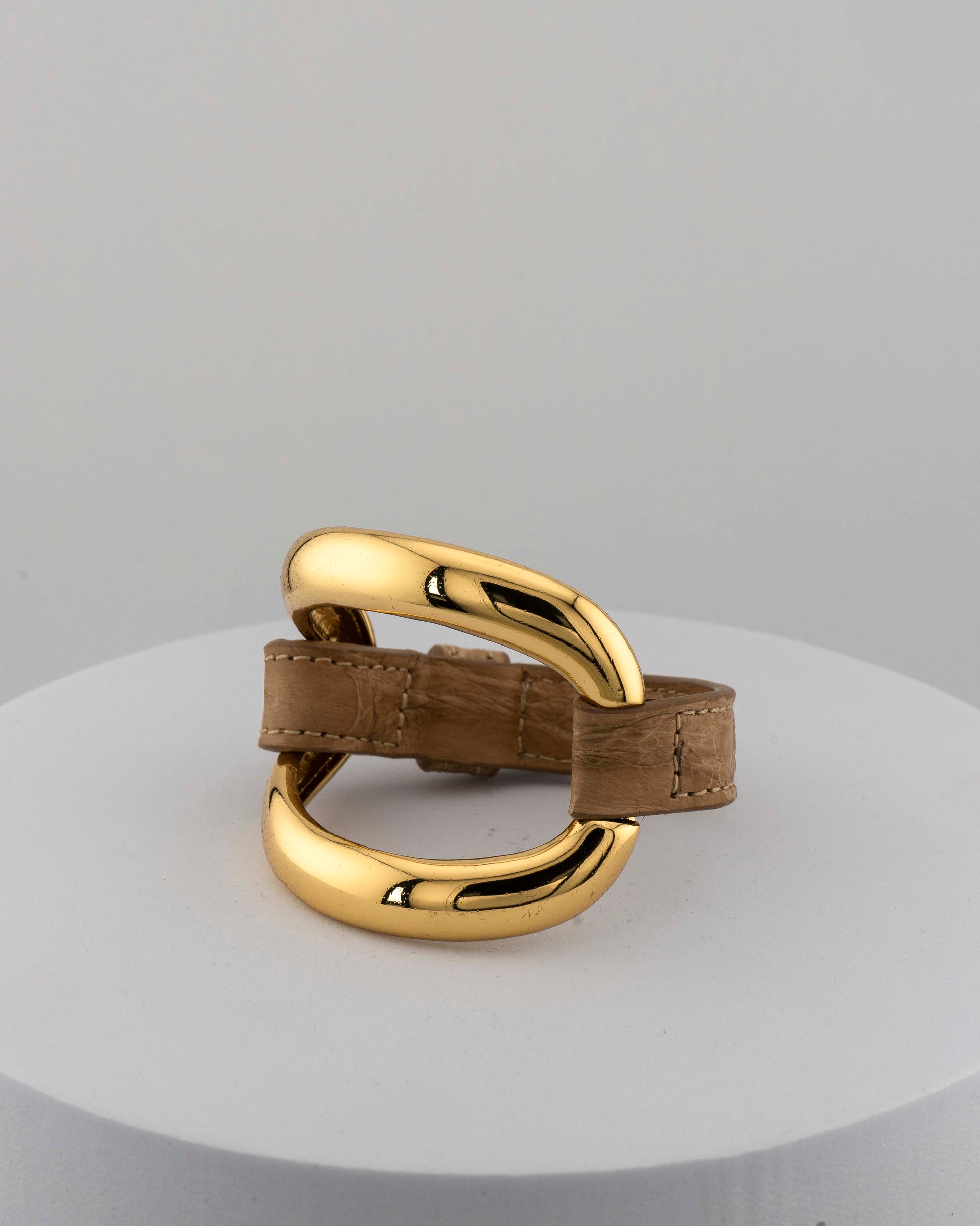 Handcrafted 18K gold-plated bronze bracelet with genuine crocodile leather strap.
An original Marri Cortona design — handmade in Tuscany.