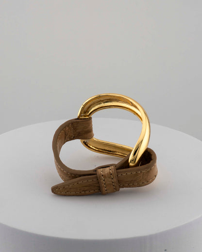 Handcrafted 18K gold-plated bronze bracelet with genuine crocodile leather strap.
An original Marri Cortona design — handmade in Tuscany.