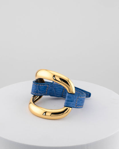 Handcrafted 18K gold-plated bronze bracelet with genuine crocodile leather strap.
An original Marri Cortona design — handmade in Tuscany.