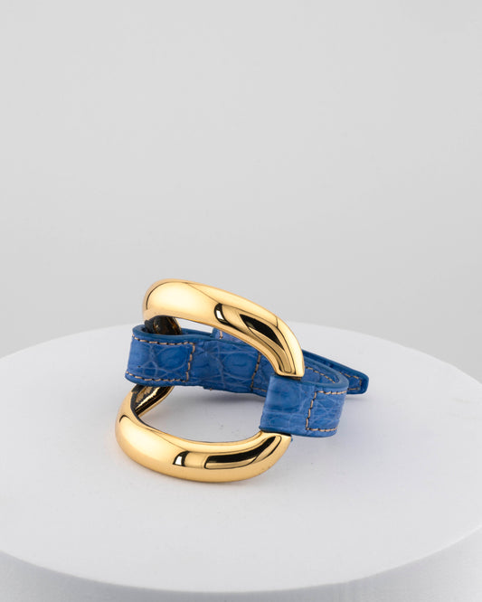 Handcrafted 18K gold-plated bronze bracelet with genuine crocodile leather strap.
An original Marri Cortona design — handmade in Tuscany.