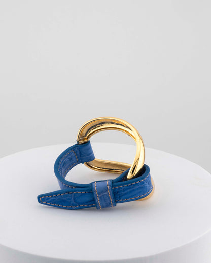 Handcrafted 18K gold-plated bronze bracelet with genuine crocodile leather strap.
An original Marri Cortona design — handmade in Tuscany.