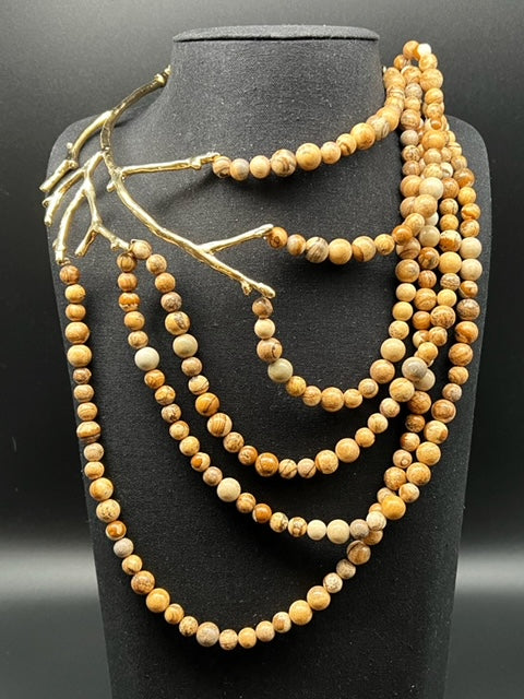 Collana ramo con perle in legno, pitone e ceramica